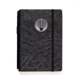A Blackwing Artist Series Slate Notebook with Florian Bertmer's art - grey and black notebook with white imprint of a circle of snakes