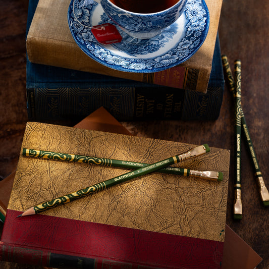 Blackwing x IBD 2025 Pencils on a book with a rustic feel.