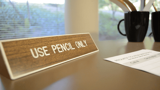 use pencils only sign on desk