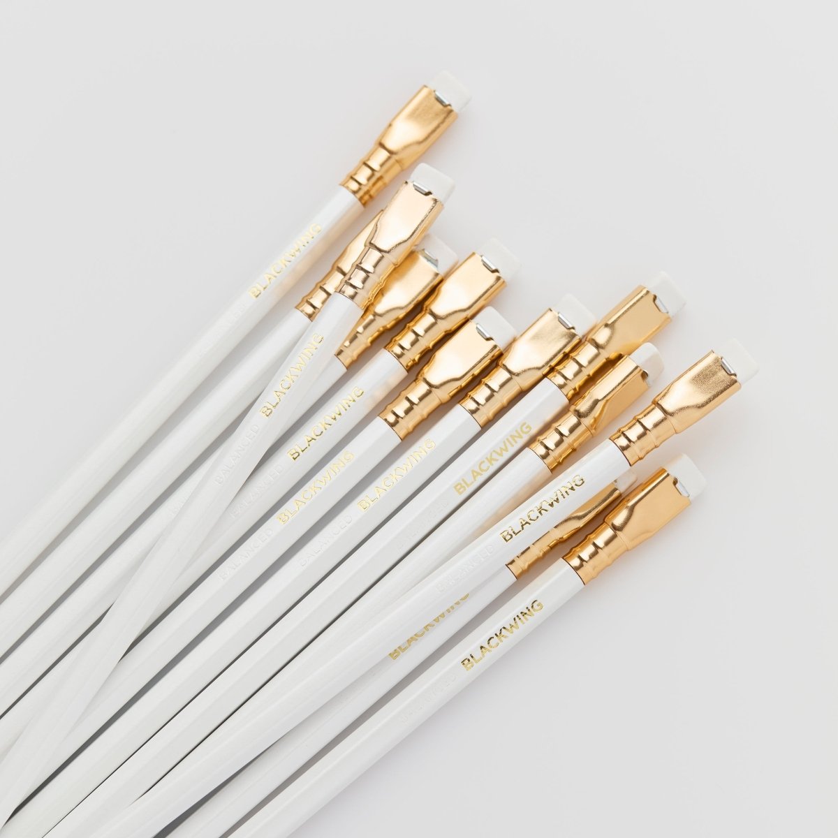 white and gold pencils