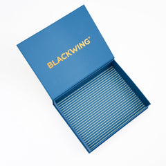 An open blue presentation box with the brand name 'BLACKWING' printed in gold on the inside lid, photographed on a clean white background.