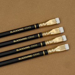 Blackwing Eras (2025 Edition) - Black barrel with white eraser, featuring a gold imprint and gold ferrule
