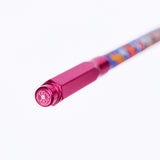 A close-up of a pink pencil point guard, featuring a white flower emblem, on a clean white background.