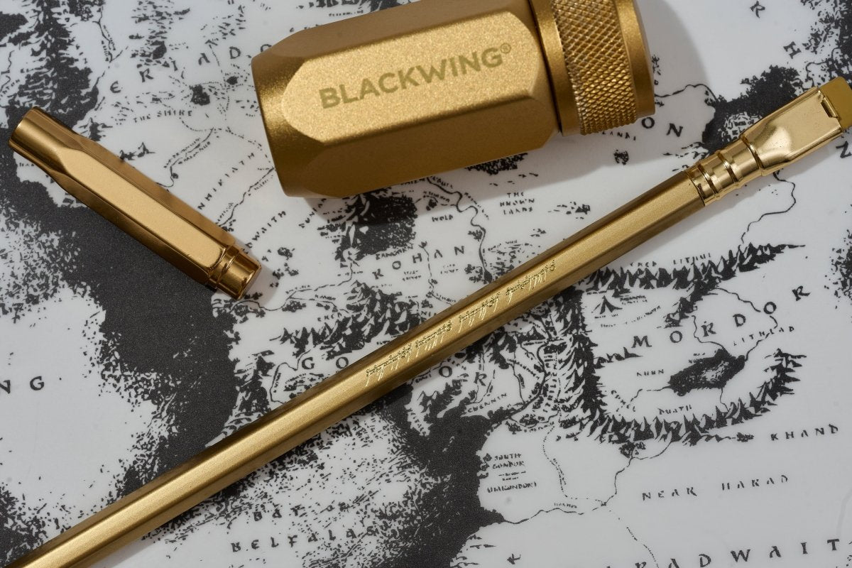 Blackwing x Lord of the Ring gold pencil and accessories on a map background