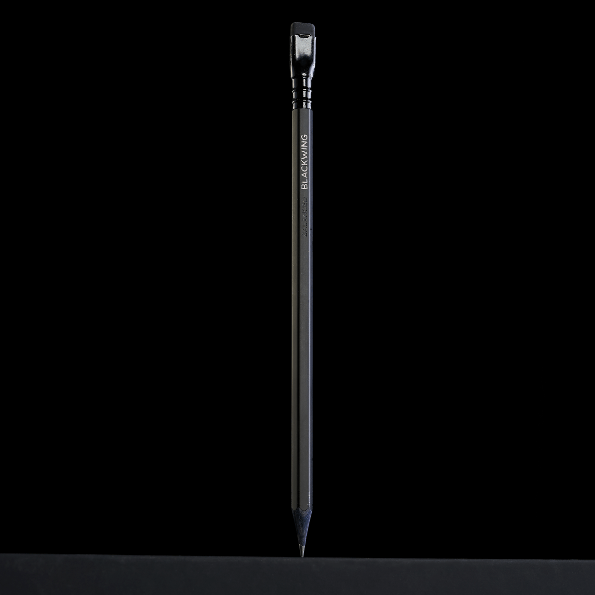 all black pencil standing up-right