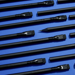 black pencils on a blue background