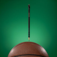 Blackwing Volume 11 Bill Russell Pencil on top of a basketball