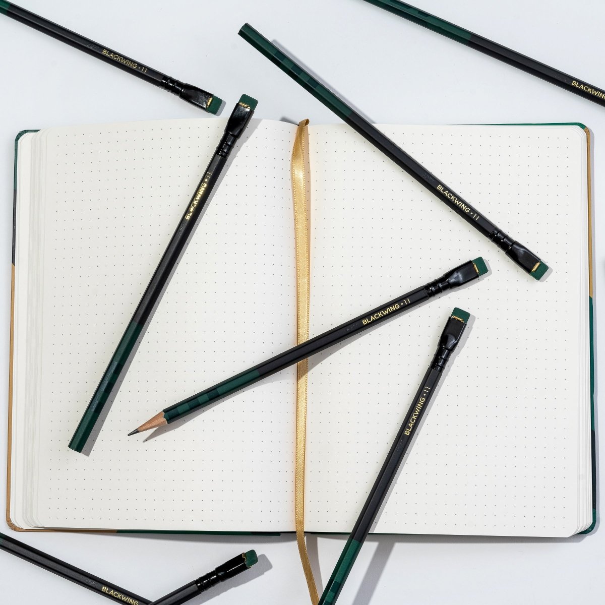 Blackwing Volume 11 Bill Russell Notebook laying open with pencils on top