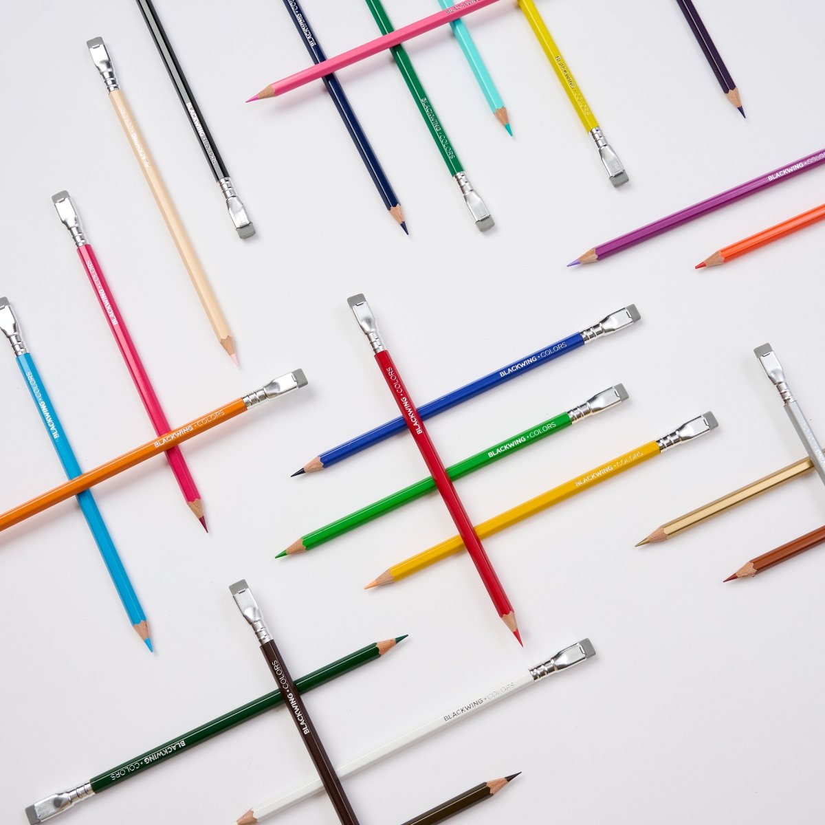 Assorted colored pencils on a white background