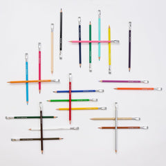 erasable colored pencils arranged on a white background