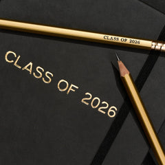 class of 2026 graduation present, includes a black notebook and gold pencils