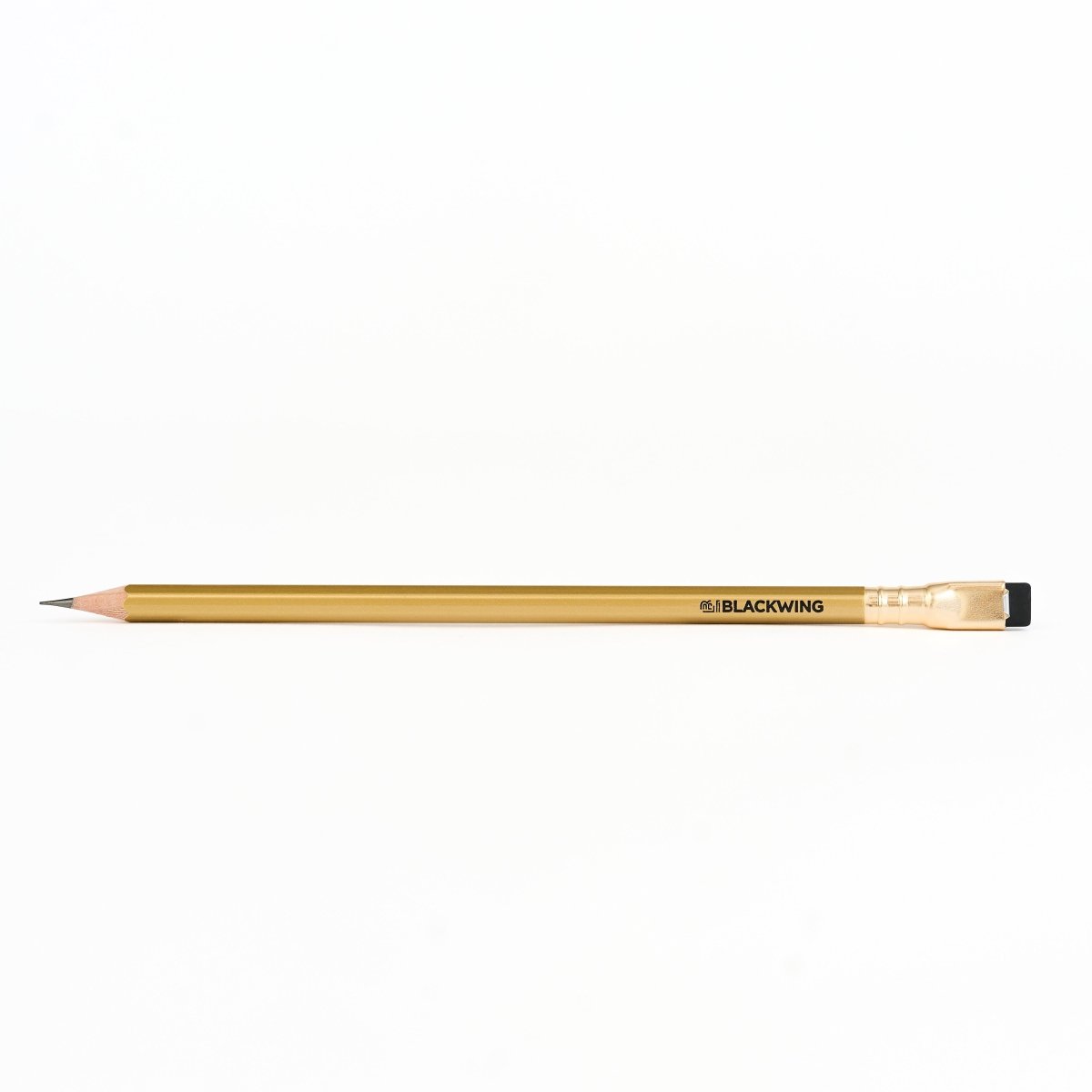 Blackwing gold pencil on a white background