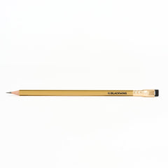 Blackwing gold pencil on a white background