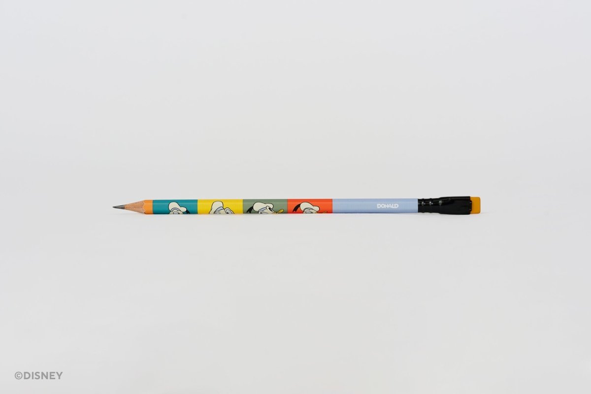A Blackwing Disney pencil with a light blue barrel, featuring colorful Donald Duck illustrations, a black ferrule, and a mustard yellow eraser, shown horizontally against a plain white background.