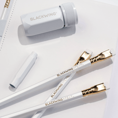 Blackwing white one-step sharpener, white pencil guard, pearl pencils, and white slate notebook