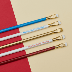 Blackwing pencils in red, white, blue, and gold, each with imprint 'THE BETTER ANGELS OF OUR NATURE' on a tan and red background