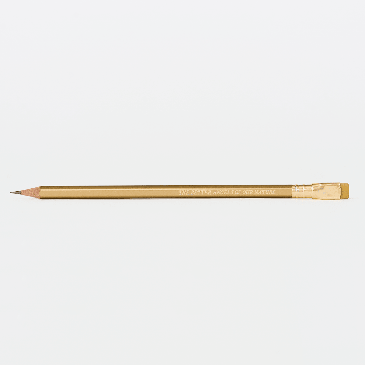 gold pencil with imprint 'THE BETTER ANGELS OF OUR NATURE' on a white background