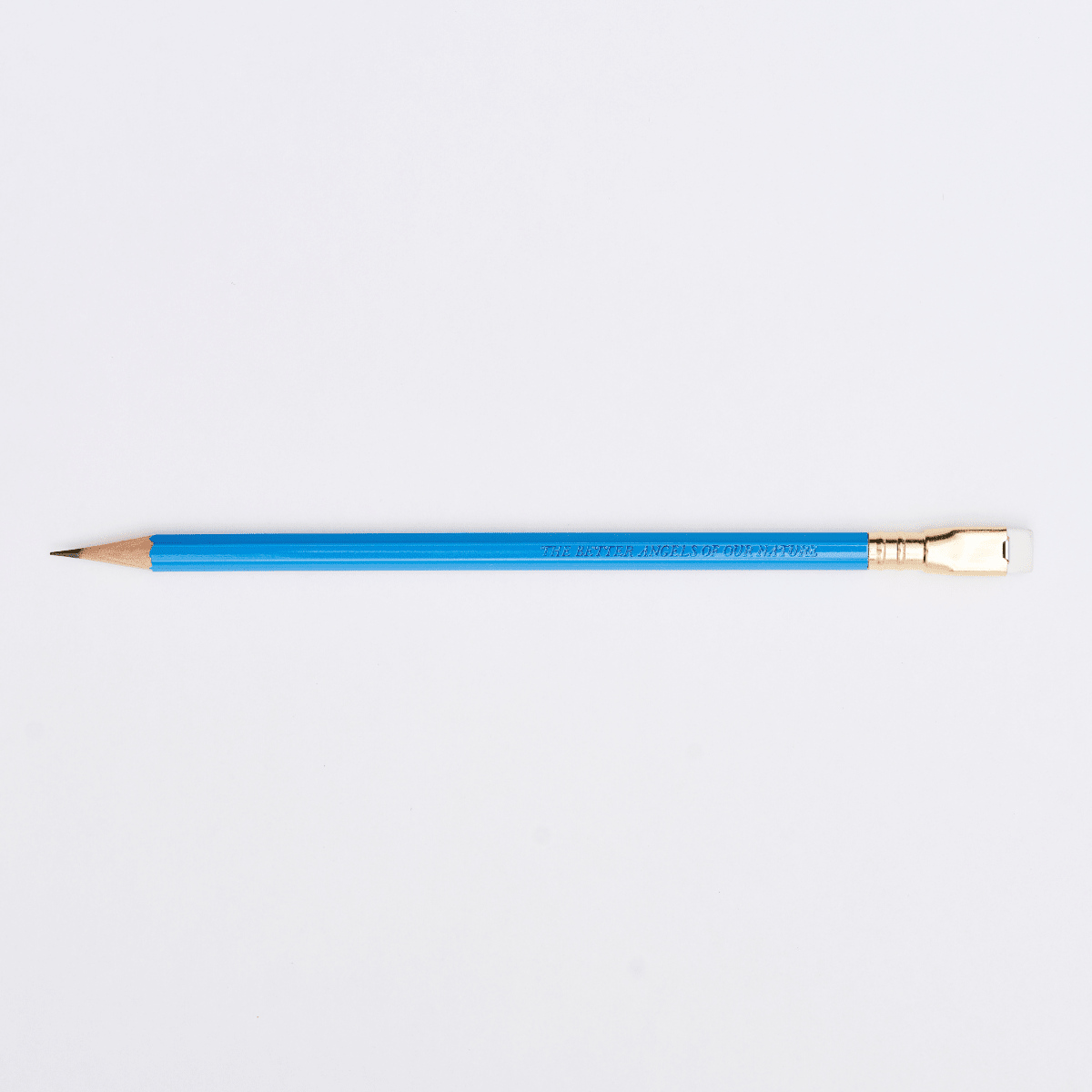 blue pencil sharpened on a white background with pencil barrel text that says 'THE BETTER ANGELS OF OUR NATURE'.