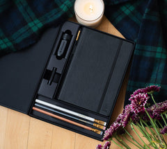 Blackwing Notebook Essentials Set includes a black slate notebook, 4 core pencils, a black pencil point protector, and a black one-step sharpener