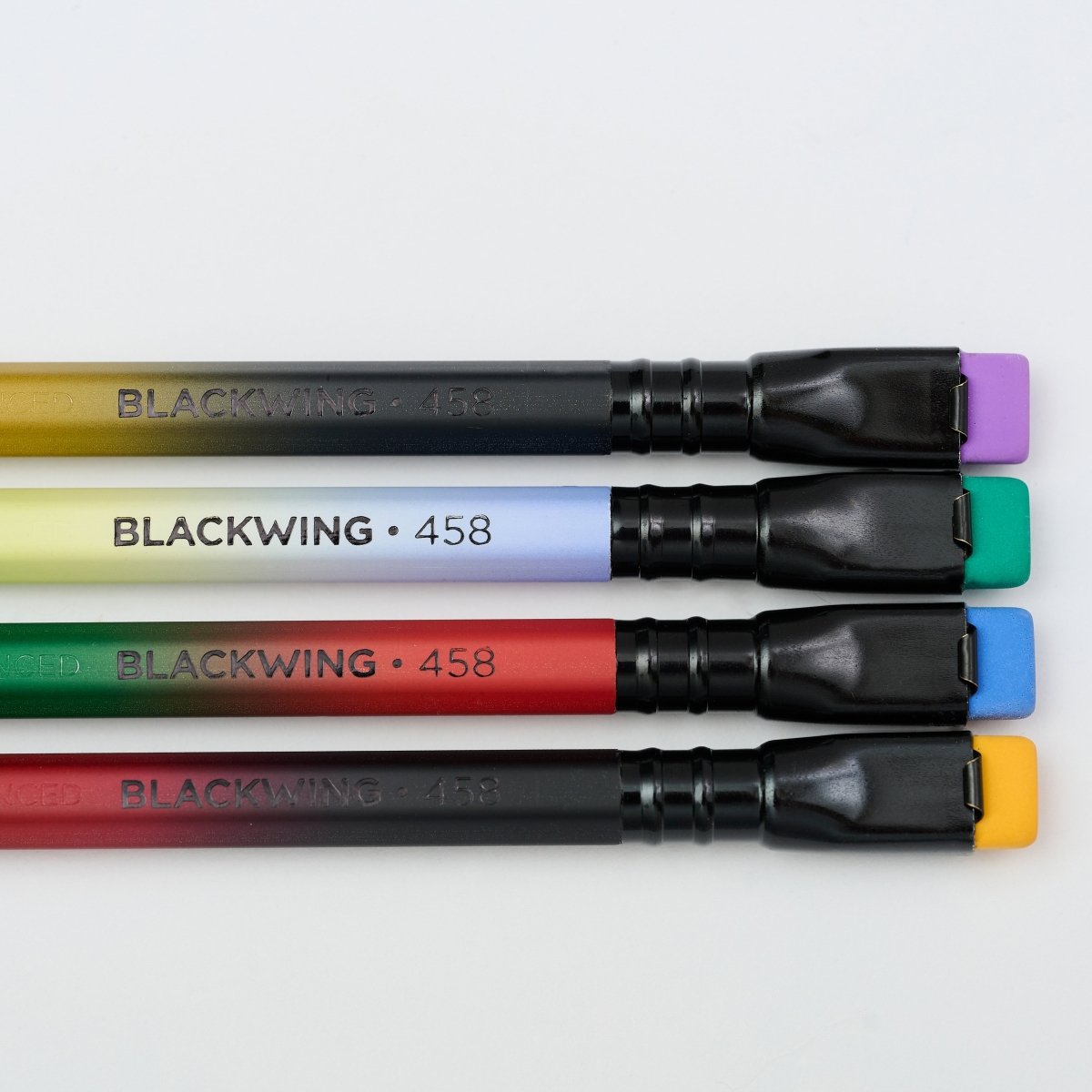 4 gradient pencils with black ferrule and colorful erasers side-by-side with 'BLACKWING 458' imprinted on the barrels