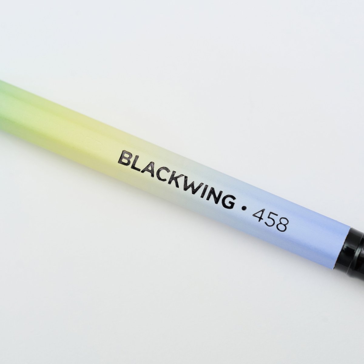 Blackwing Volume 458 gradient pencil with light green, yellow, and sky blue barrel, black imprint, and black ferrule