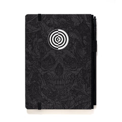 A Blackwing Artist Series Slate Notebook with Florian Bertmer's art - grey and black notebook with skull art and white target imprint 
