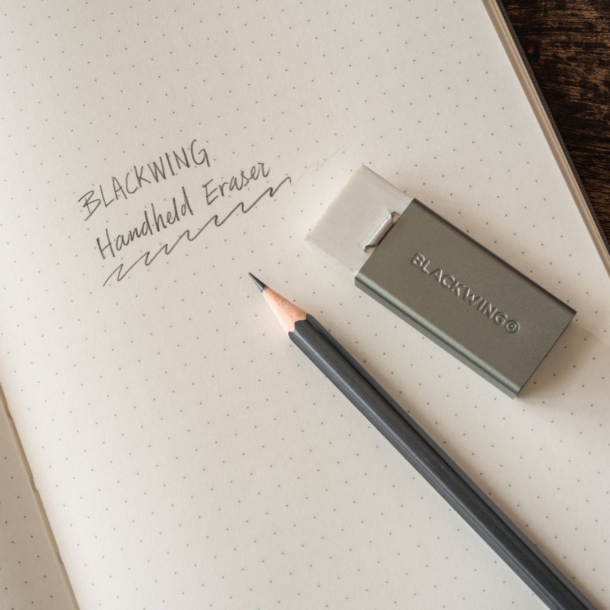 Blackwing Soft Handheld Eraser sitting on a notebook with a pencil