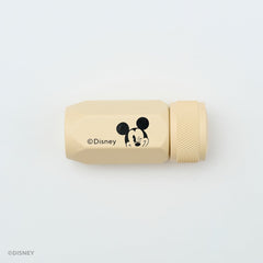 A beige Disney sharpener with a black Mickey Mouse face graphic and the Disney copyright text, shown on a clean white background.