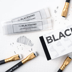 Blackwing Lab 11.25.22 pencils and erasers on a white background.