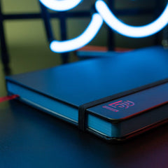 Blackwing Volume 6 Medium Slate Notebook in black with red "B" emblem and red placeholder ribbon